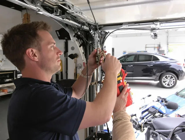 Medina Garage Door Repair safety certified technician performing cable replacement in Medina