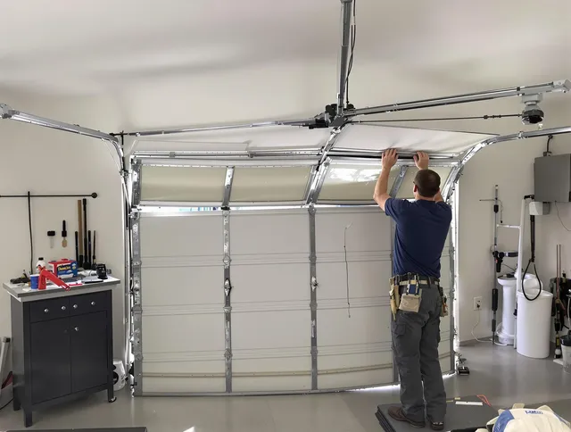 Medina Garage Door Repair specialist performing precise section replacement on Medina garage door