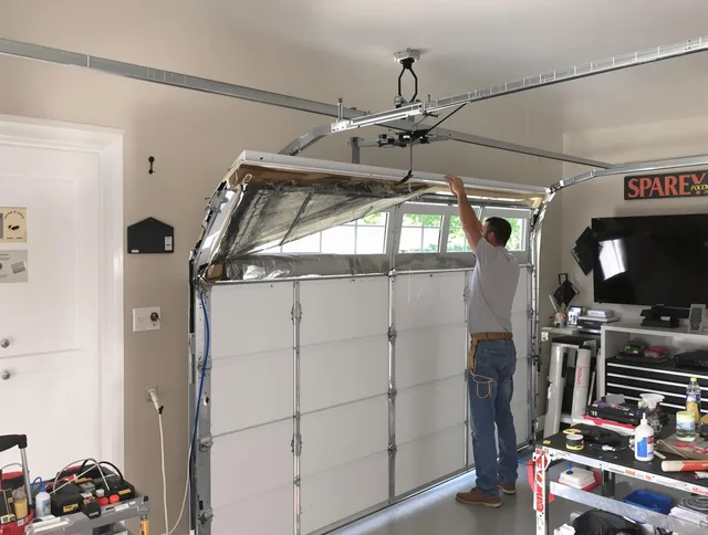 Garage door section replacement by Medina Garage Door Repair in Medina